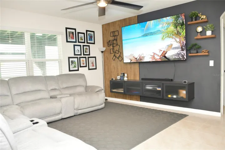 Living room with custom cabinet and accent wall