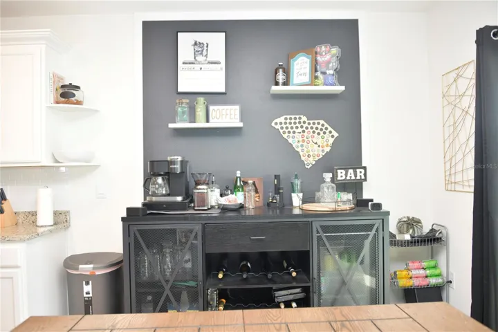 Breakfast Nook with accent wall and shelves