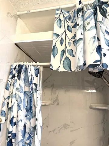 Storage area above shower.
