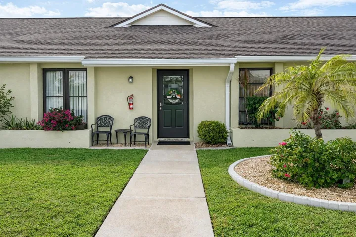 Front Exterior with newer curbing around island.