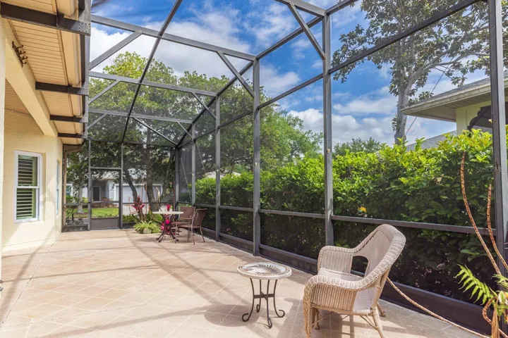 Large screened in back porch with outdoor kitchen