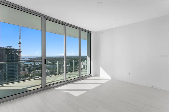 Bedroom #2 with balcony access.