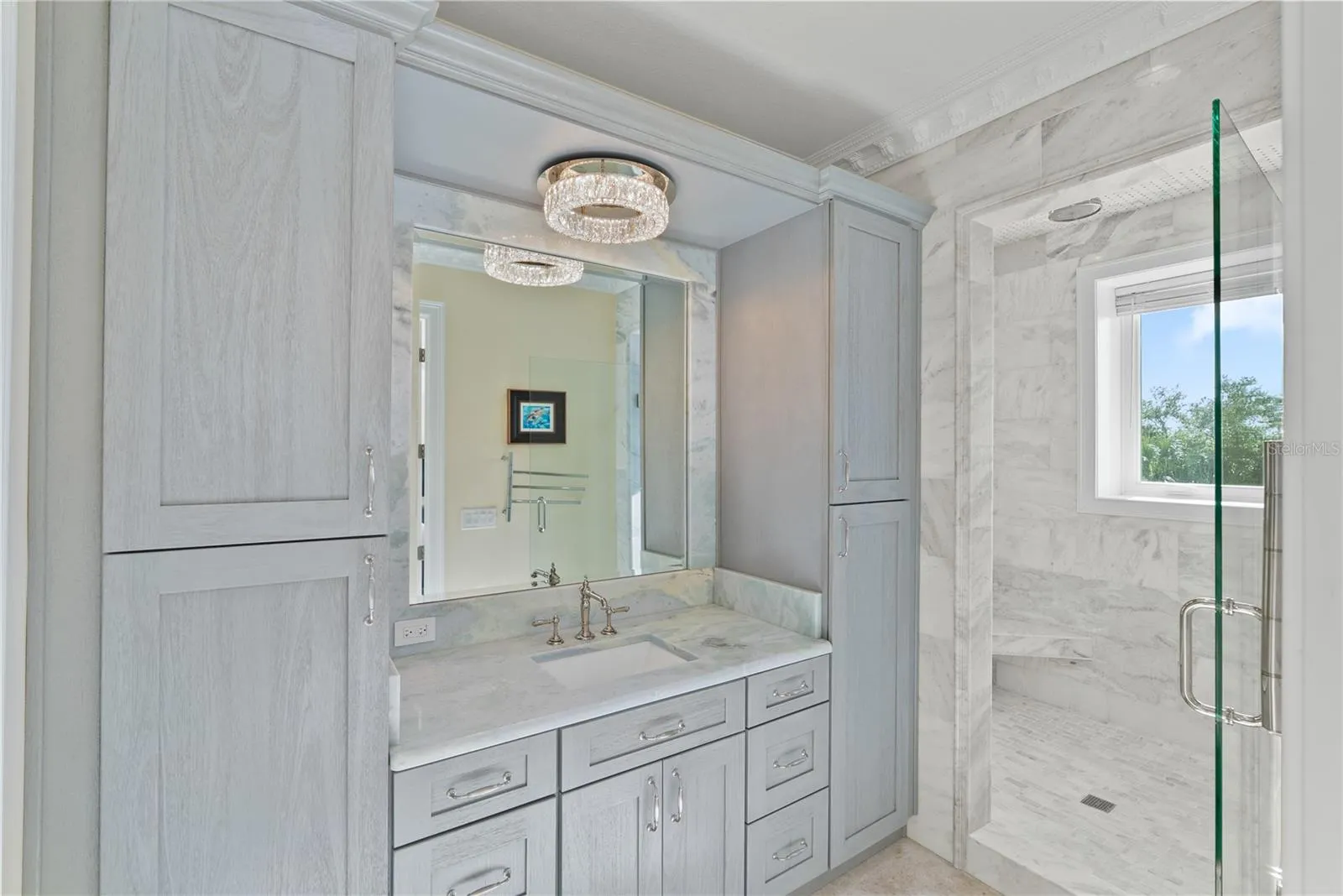 Elegant marble bath with refined finishes and spa-inspired design.