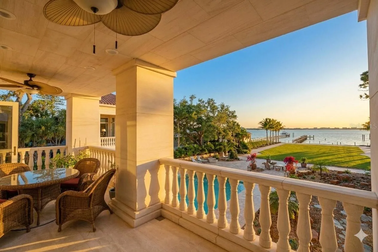 Grand-scale living with seamless indoor-outdoor flow.  Limestone stairs take you directly to the resort style pool from the kitchen area.