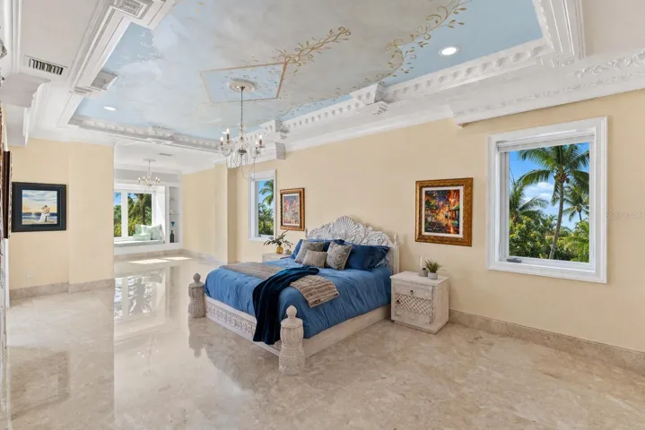 Private primary suite with panoramic water views and custom finishes.