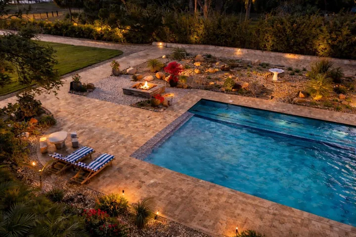 Resort-style pool and spa illuminated for unforgettable evenings under the stars.