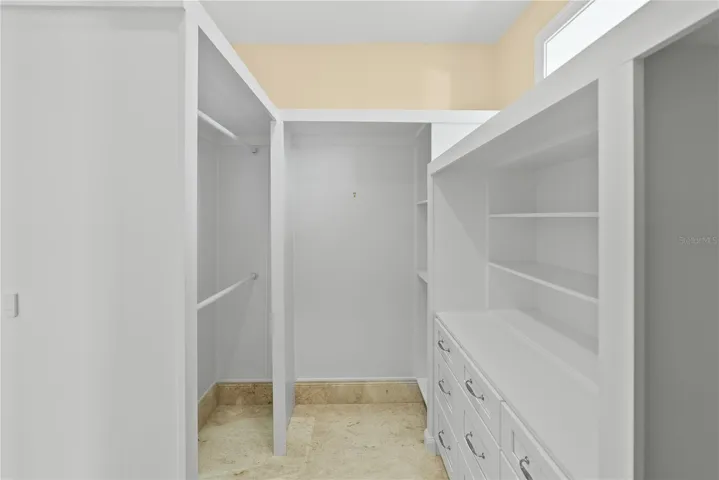 Immaculate custom closets with abundant storage, maintained in like-new condition.