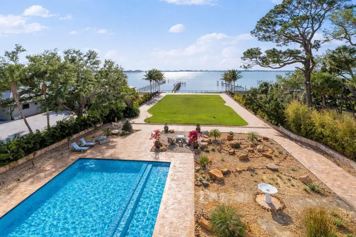 Resort-style pool and spa set within expansive, beautifully designed grounds.