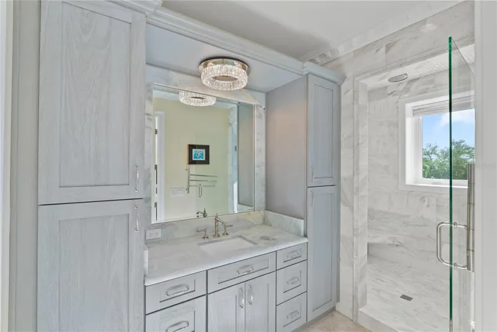 Elegant marble bath with refined finishes and spa-inspired design.