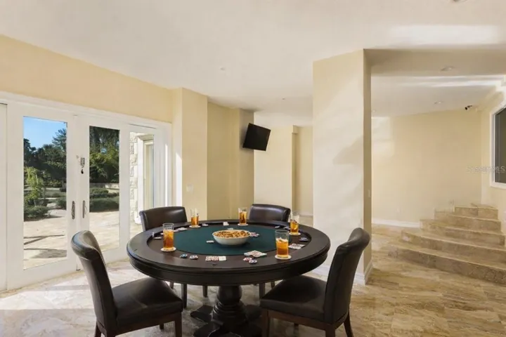 Versatile lower-level space ideal for entertaining or recreation.