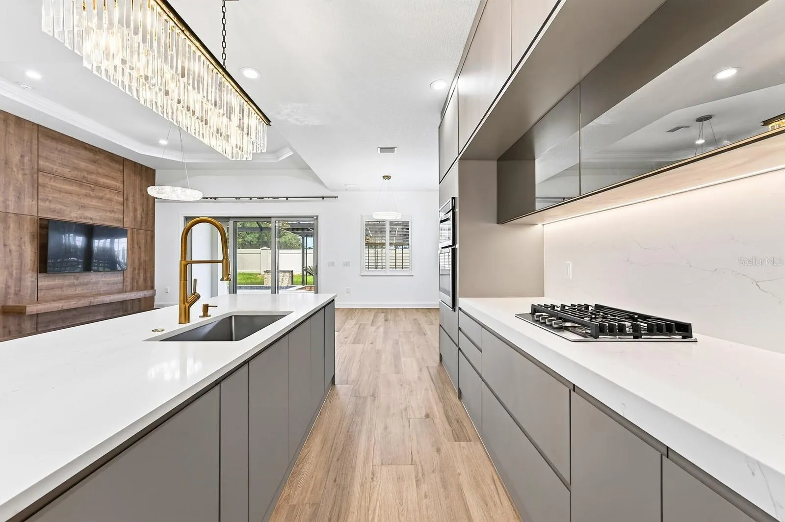 Kitchen is complete with a built-in gas cooktop.