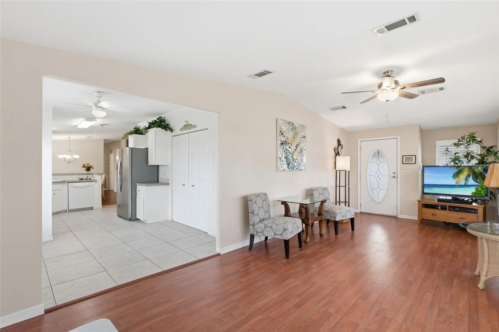 Living room, entrance, and kitchen area