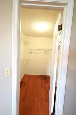 Primary bedroom walk-in closet