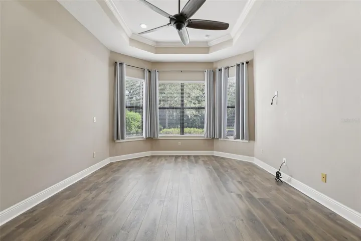 Master bedroom with triple tray ceilings with recessed lighting