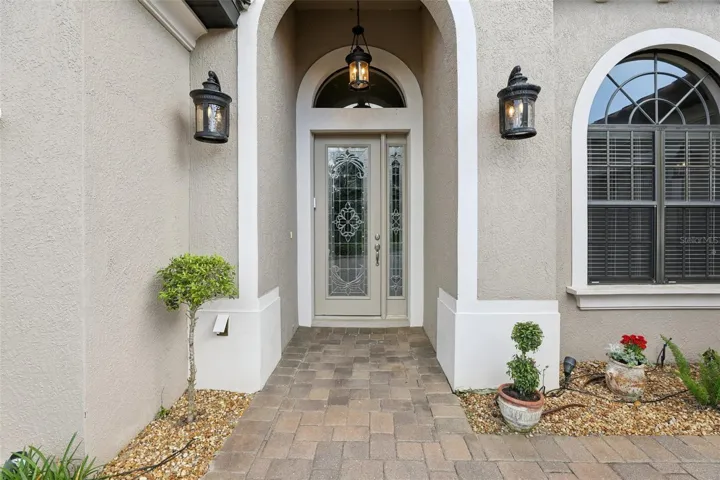 Covered Front entry with beautiful etched glass