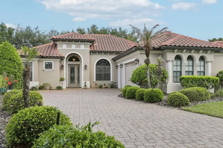 Beautiful paver driveway leading to your 3 car side garage under air with mini split