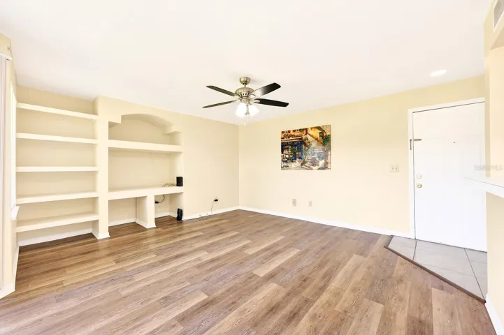 Step inside to an OPEN-CONCEPT LAYOUT where the Living Room, Dining area, and Kitchen flow seamlessly together, enhanced by WOOD-LOOK VINYL FLOORING in the main living spaces.