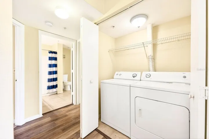 Just off the Kitchen, you’ll find a laundry closet with a washer and dryer, adding everyday convenience.
