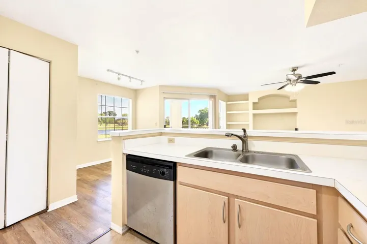 The Kitchen is both functional and stylish, complete with stainless steel appliances, a closet pantry, and a CONVENIENT BREAKFAST BAR for casual dining.