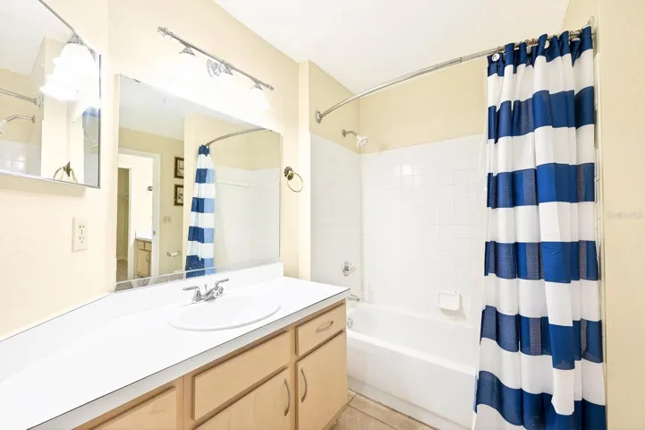 The spacious Bath is easily accessible from both Bedrooms.