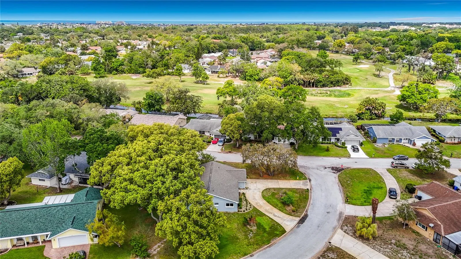 Aerial View of the home and back drop of the golf course