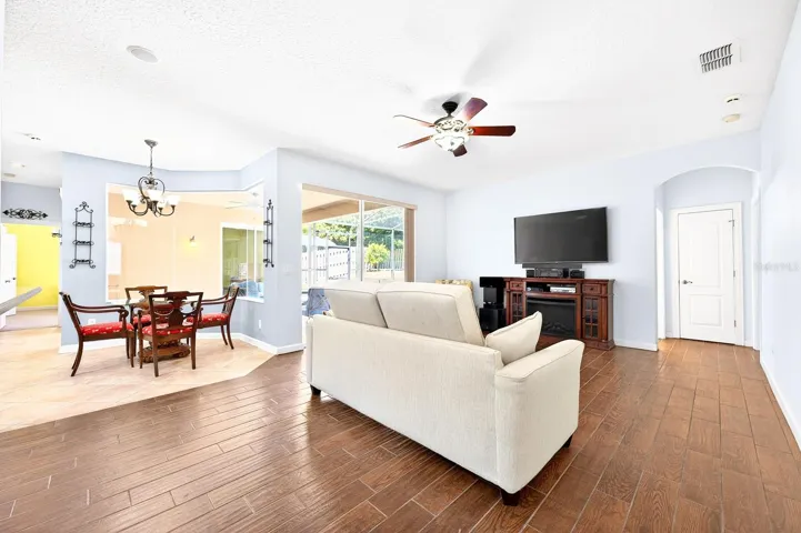 Spacious family room has sliding glass door access to the lanai.