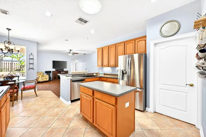 Kitchen is open to a casual dining space and the family room.