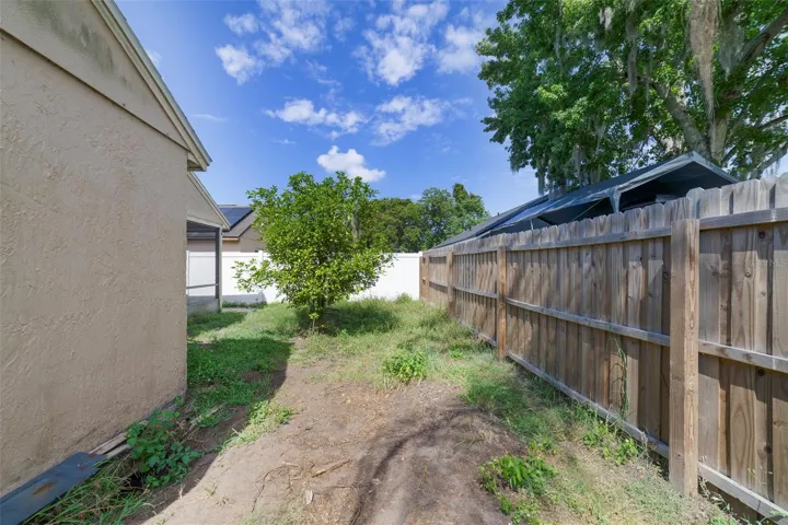 The FENCED BACKYARD offers plenty of room for gardening, outdoor entertaining, pets, or future enhancements.