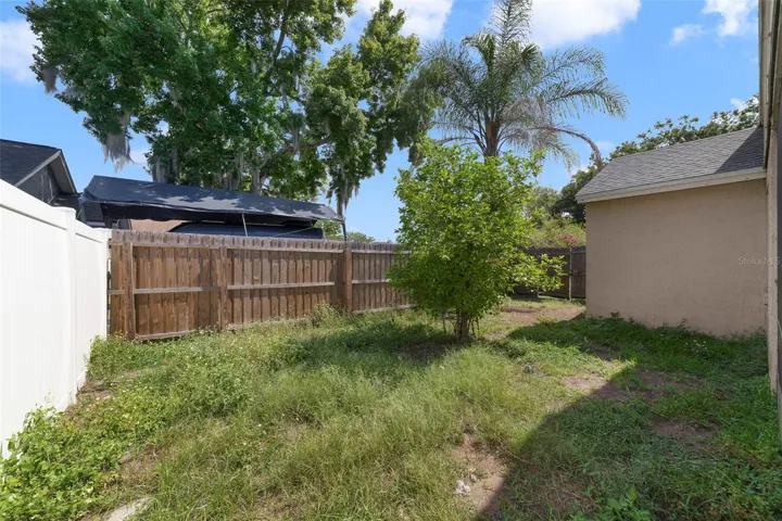 The FENCED BACKYARD offers plenty of room for gardening, outdoor entertaining, pets, or future enhancements.