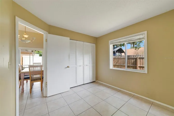 The second bedroom is conveniently located near the home's SECOND FULL BATHROOM, making it ideal for guests, family members, or a home office.