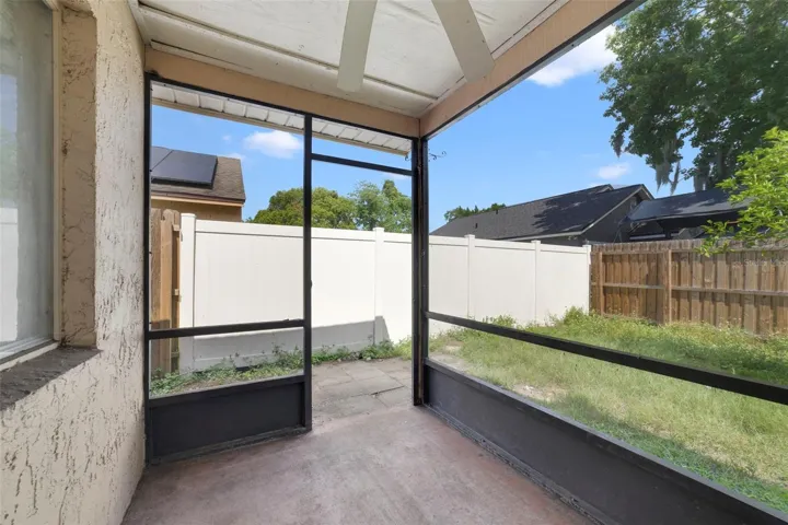 The back patio provides a place to enjoy your morning coffee, unwind in the evening, or envision the possibilities for the FENCED BACKYARD.