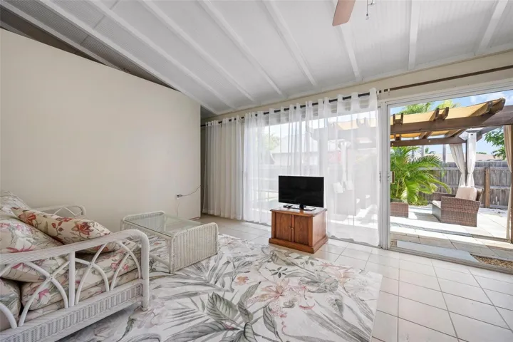 Florida room with wall of sliding glass doors