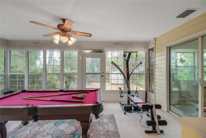 GLASSED IN FLORIDA ROOM UNDER HEAT AND AIR
