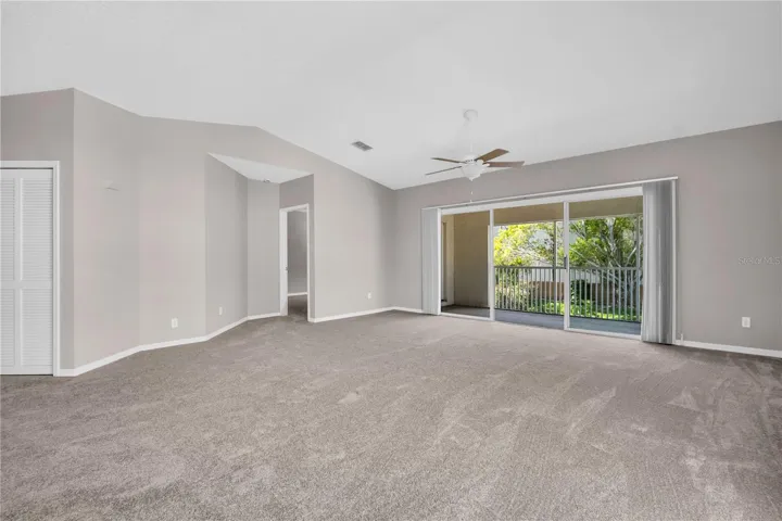 Large open floor plan w sliding doors to the balcony ~