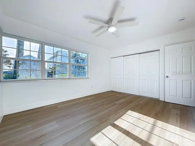 PRIMARY BEDROOM WITH WATER VIEW