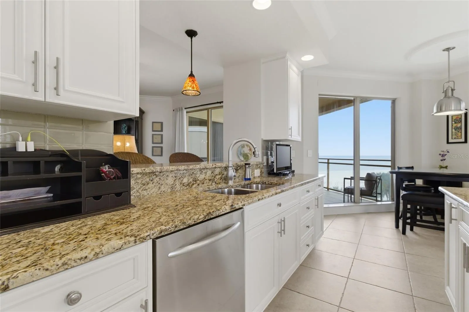 Plenty of room for island, kitchen table, and also barstools.
