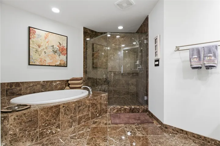 Primary bathroom provides double vanity.