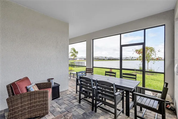 Large covered lanai with panoramic views of the lake