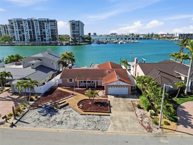 Drone shot of existing structure on 4 Bellevue Dr looking south at The Devil's Elbow on the Intracoastal and the one bridge to the Gulf of Mexico in the foreground on the right.