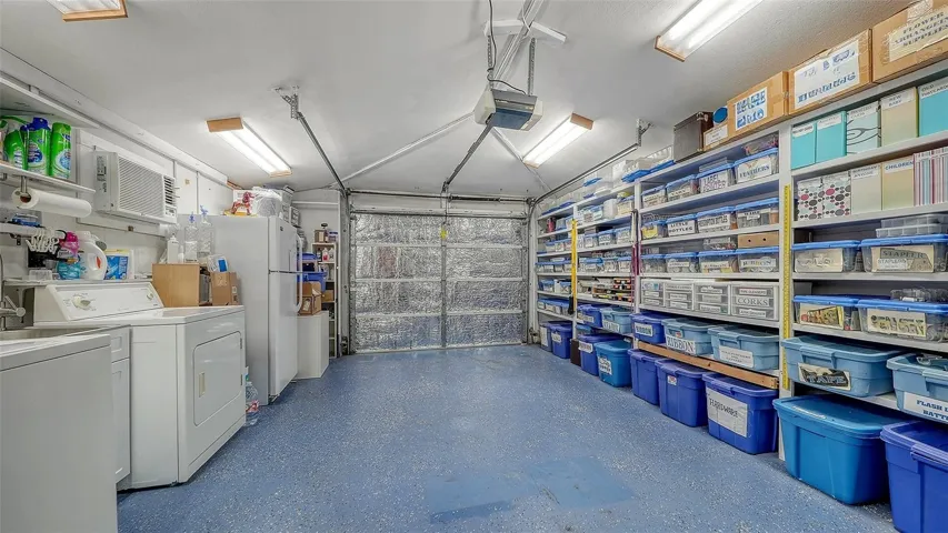 Oversized 1 car garage with plenty of space for storage & laundry.