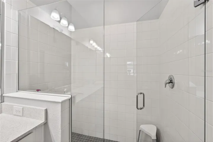 Primary shower with frameless enclosure
