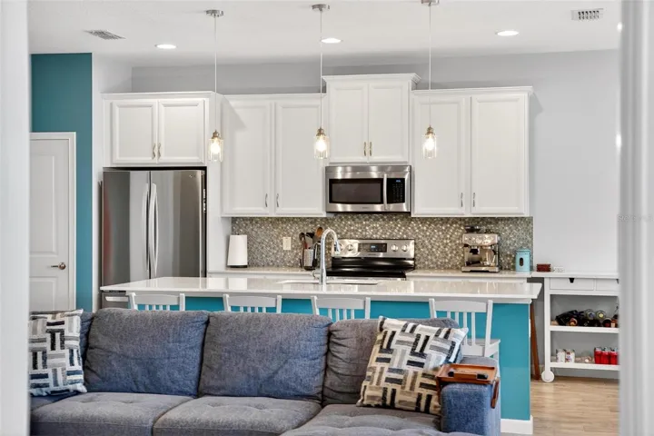 Large kitchen island with quartz countertop