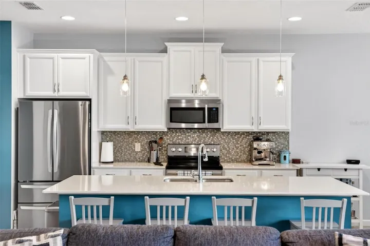 Pendant lights over large island