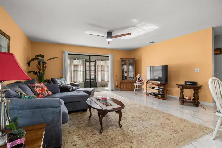 Spacious living room with sliders to Florida room