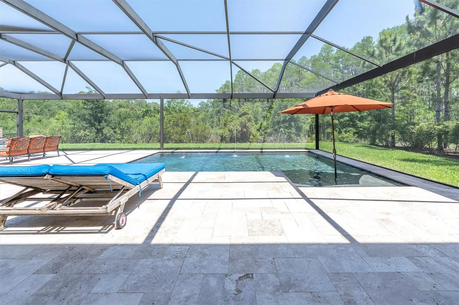 COOL TRAVERTINE DECK AFFORDS SPACE TO RELAX &amp; ENTERTAIN