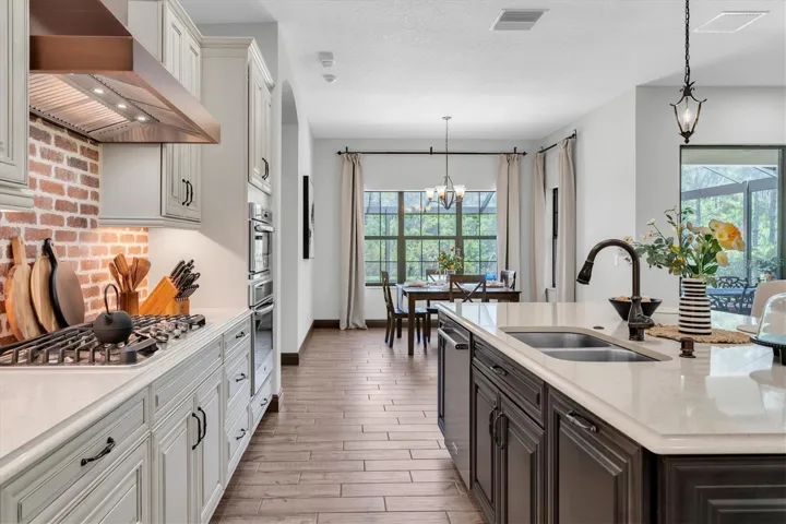 GLEAMING QUARTZ COUNTERS ILLUMINATED BY UNDER CABINET LIGHTS
