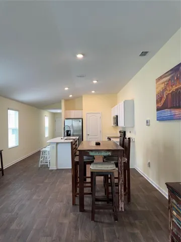 Looking from living into dining and kitchen area