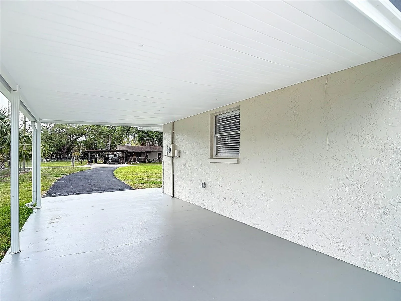 Carport with painted concrete floor!