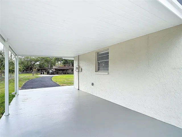 Carport with painted concrete floor!