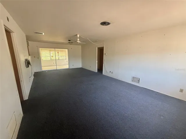 Living Room/Dining Room and sliders to Office/Den